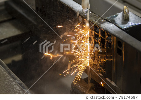 The wire EDM machine cutting the insert mold parts.  78174687