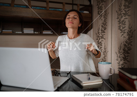 Upset asian woman working from home office. 78174791
