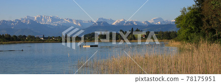 Swimming place in Seegraben, Zurich Canton. Snow covered mountains. 78175951