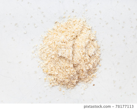 pile of ground asafetida close up on gray 78177113