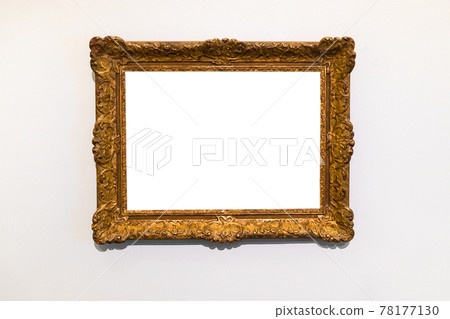 old decorated wide gold picture frame on gray wall old decorated wide gold picture frame on gray wall 78177130