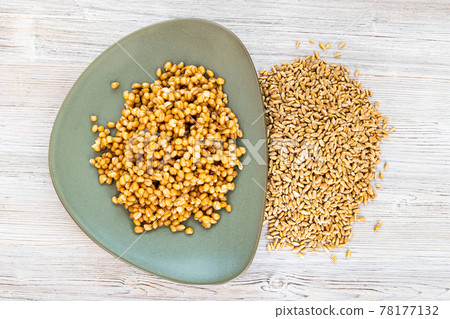 top view of raw whole wheat grains and porridge top view of raw whole wheat grains and porridge 78177132
