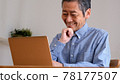 Senior man enjoying surfing the internet 78177507