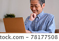 Senior man enjoying surfing the internet 78177508