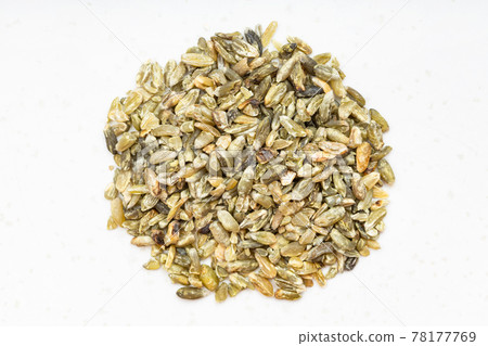 pile of freekeh wheat grains close up on gray 78177769