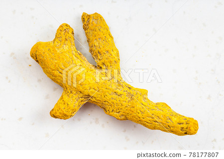 root of Turmeric (Curcuma) close up on gray 78177807