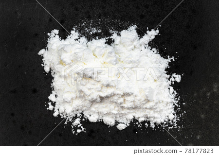 view of pile of baking powder close up on black 78177823