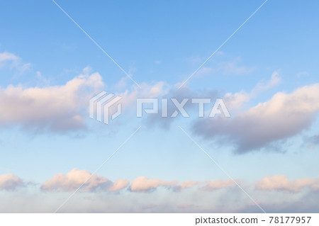 chain of fluffy clouds in blue sunset sky chain of fluffy clouds in blue sunset sky 78177957