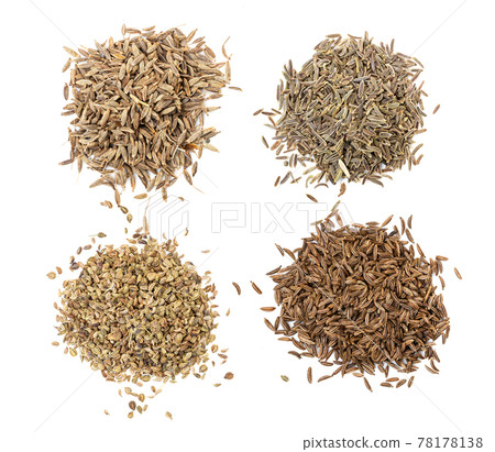 various caraway like seeds on white plate 78178138