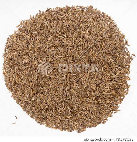 pile of caraway seeds on gray ceramic plate 78178153