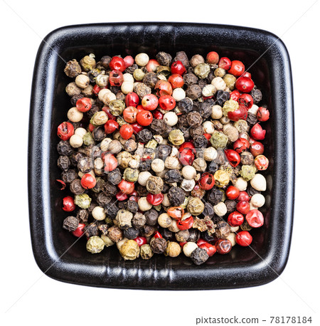 Pepper Blend peppercorns in black bowl isolated 78178184