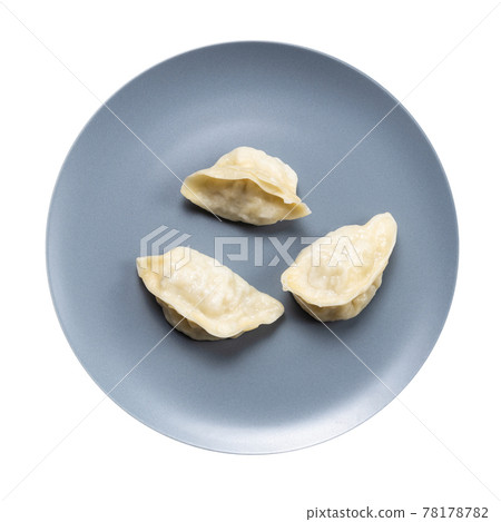 few boiled dumplings on gray plate isolated 78178782