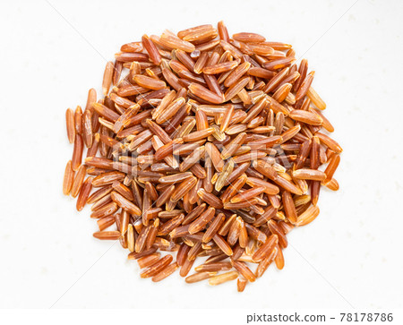 pile of raw red rice close up on gray pile of raw red rice close up on gray 78178786