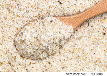 top view of wood spoon with psyllium husk close up top view of wood spoon with psyllium husk close up 78178889