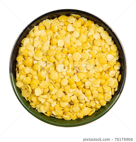 raw split yellow lentils in round bowl isolated 78178908