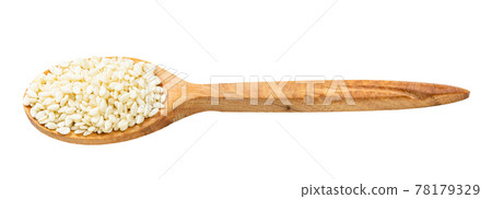 wooden spoon with raw white sesame seeds isolated wooden spoon with raw white sesame seeds isolated 78179329