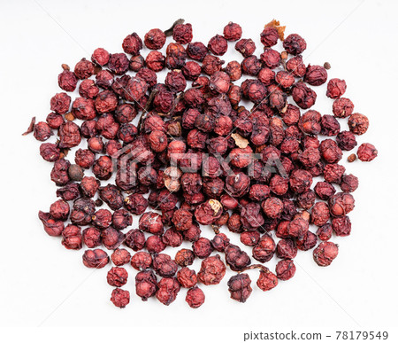pile of dried magnolia berries close up on gray pile of dried magnolia berries close up on gray 78179549