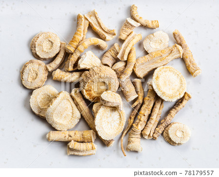 sliced dried parsley roots close up on gray sliced dried parsley roots close up on gray 78179557