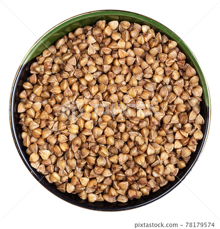 roasted buckwheat grains in round bowl isolated 78179574