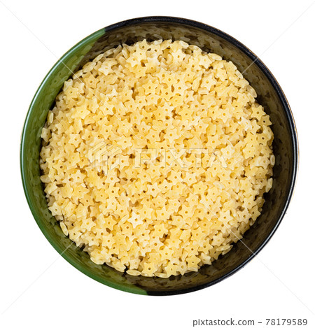 uncooked stelline pastina in round bowl isolated 78179589