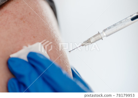 Close-up on syringe with Covid 19 vaccine 78179953