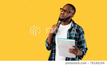 Thoughtful African Guy Thinking Holding Pen And Notebook, Studio Shot Thoughtful African Guy Thinking Holding Pen And Notebook, Studio Shot 78180284