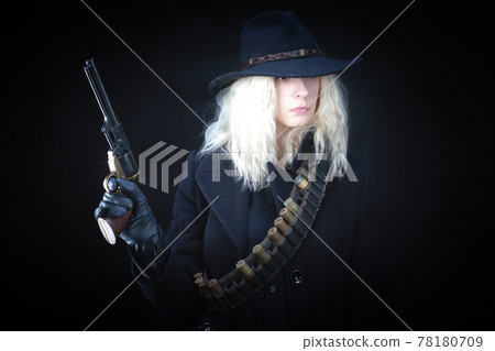 blonde girl wearing black hat with revolver blonde girl wearing black hat with revolver 78180709