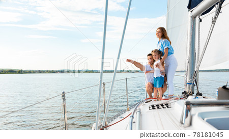 Happy Family Embracing Standing On Yacht Looking Pointing Aside Outdoors 78181045