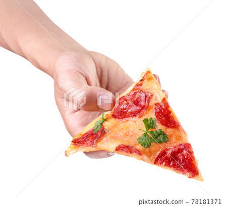 Slice of salami and mozzarella pizza in hand on white background. Isolated Slice of salami and mozzarella pizza in hand on white background. Isolated 78181371