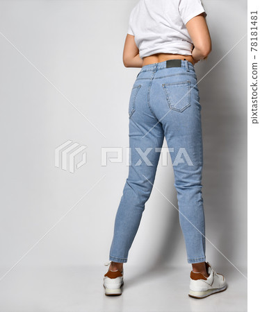 young skinny woman dressed in stylish blue jeans young skinny woman dressed in stylish blue jeans 78181481