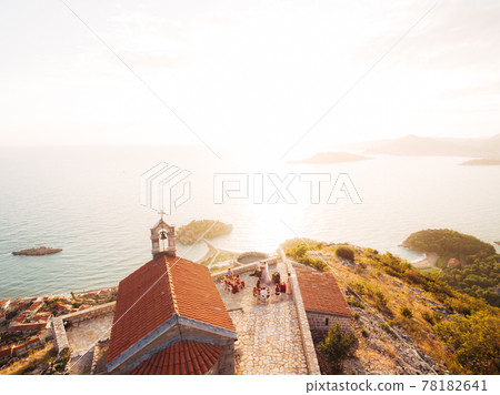 Wedding ceremony near the ancient monastery on the observation deck overlooking the island of Sveti Stefan Wedding ceremony near the ancient monastery on the observation deck overlooking the island of Sveti Stefan 78182641