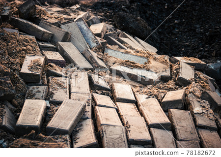 Landslide demolished pavement. Broken paved footpath on landslide Landslide demolished pavement. Broken paved footpath on landslide 78182672