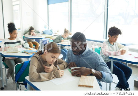 Teacher Helping Students in Class Teacher Helping Students in Class 78184152