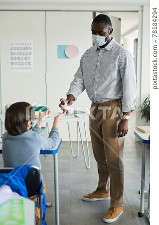 Hand Sanitizing in School Classroom 78184294