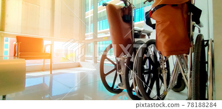 Empty wheelchair in private hospital for service patient and disabled people. Medical equipment in hospital for assistance handicapped old people. Chair with wheels for patient care in nursing home. 78188284