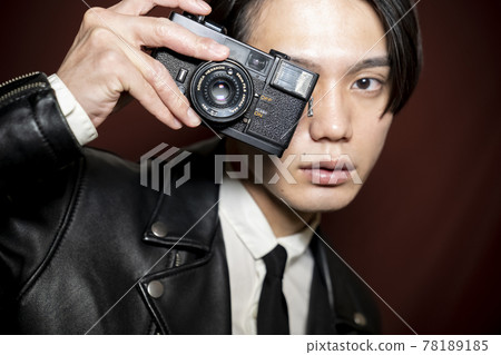 A man with a camera A man with a camera 78189185