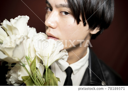 Portrait of a man with flowers 78189371