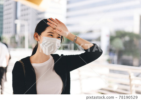 Adult business asian working woman wear face mask  sick with corona virus pandemic 78190529