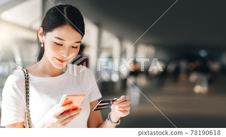Young adult business asian woman consumer using creadit card and smartphone for shopping online. Young adult business asian woman consumer using creadit card and smartphone for shopping online. 78190618
