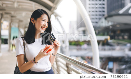 Young adult business asian woman consumer using creadit card and smartphone for shopping online. Young adult business asian woman consumer using creadit card and smartphone for shopping online. 78190621