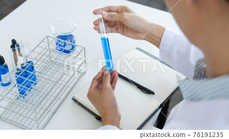 scientists researching in laboratory in white lab coat, gloves analysing, looking at test tubes sample, biotechnology concept scientists researching in laboratory in white lab coat, gloves analysing, looking at test tubes sample, biotechnology concept 78191235