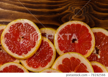 Sliced grapefruits on wooden table. Top view, copy space Sliced grapefruits on wooden table. Top view, copy space 78192566
