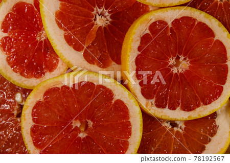 Fresh slices of grapefruits as background 78192567