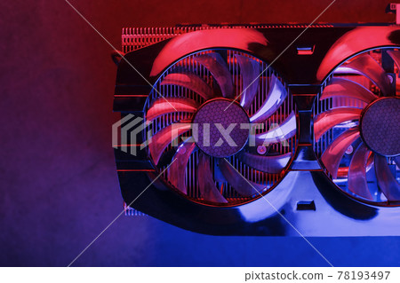 Gaming graphics card with neon magenta-cyan illumination and high-speed fans. 78193497
