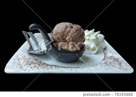 Die cut of chocolate Lava Cake with Ice Cream Chocolate and whipping cream on white plate, focus selective. Die cut of chocolate Lava Cake with Ice Cream Chocolate and whipping cream on white plate, focus selective. 78193888