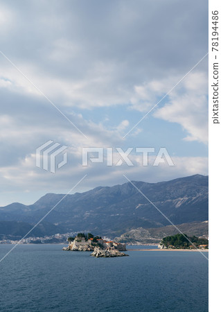 View from the sea to Sveti Stefan island against the background of mountains, Montenegro View from the sea to Sveti Stefan island against the background of mountains, Montenegro 78194486