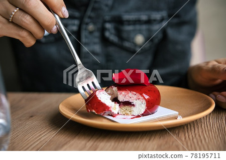 French mousse cake covered with red glaze on wooden background. Modern european cake pastry. Shallow 78195711