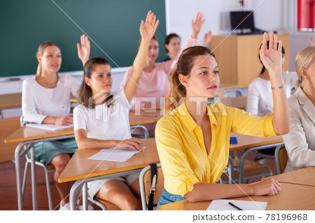 Students raising hands to answer Students raising hands to answer 78196968