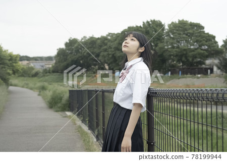 School girls looking up at the sky School girls looking up at the sky 78199944