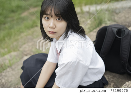 High school girl sitting on the stairs High school girl sitting on the stairs 78199976